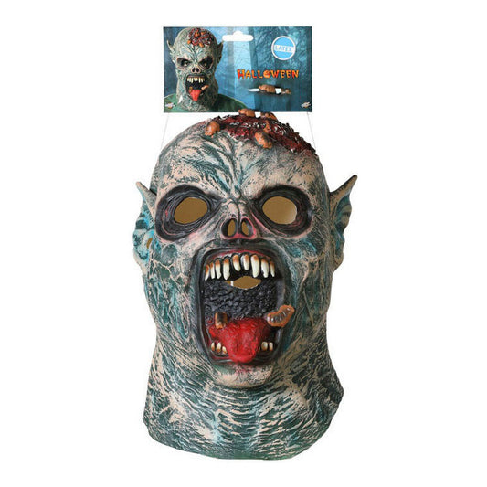 Heltäckande zombiemask i latex med ruttnande grön hud, en blottad blodig hjärna och en vidöppen mun med vassa tänder hänger från förpackning.