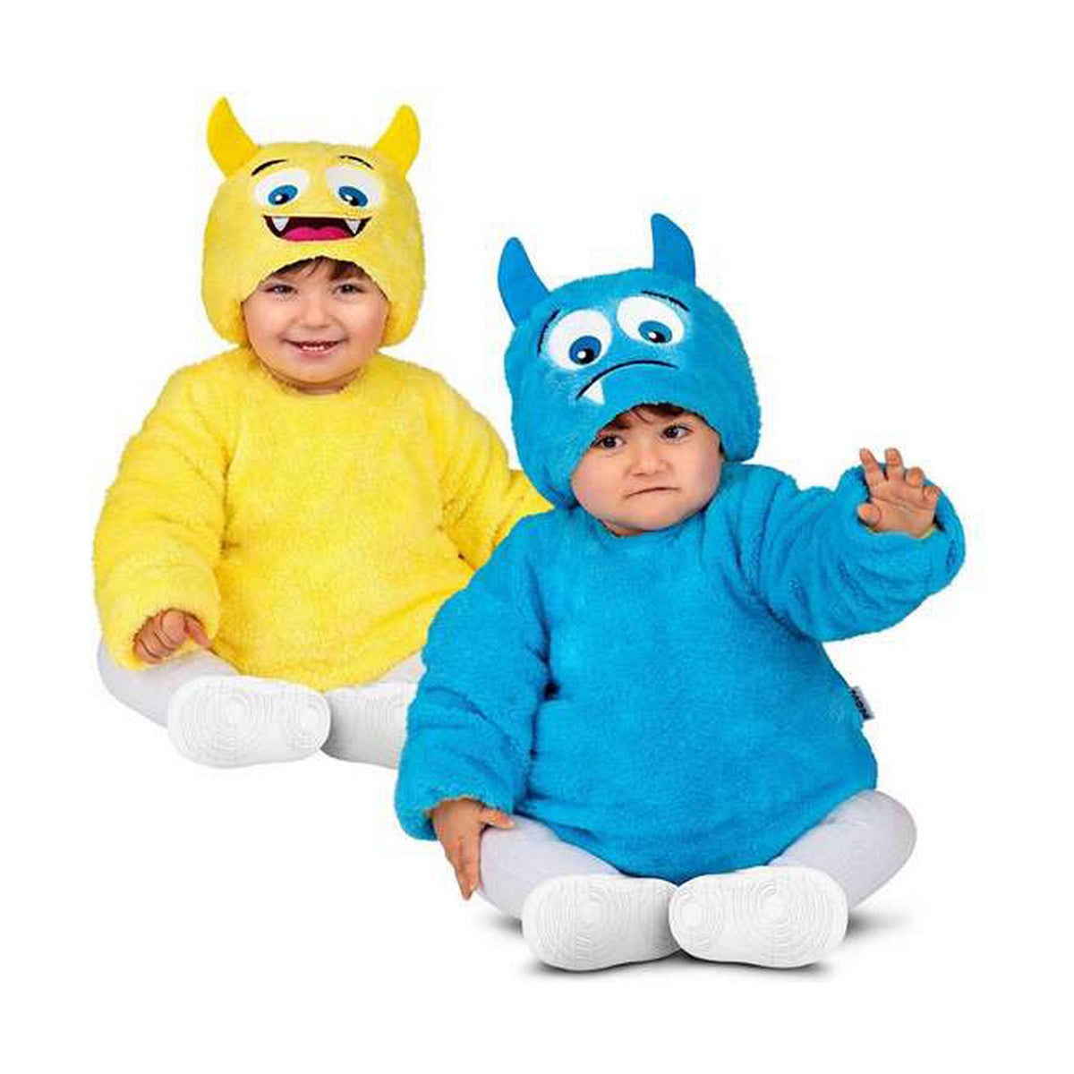 Två små barn sitter och poserar i en vändbar monsterdräkt; ett barn är gult med ett glatt monsteransikte på luvan och det andra barnet är blått med ett lite ledset monsteransikte på luvan.