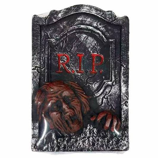 En skrämmande gravsten med texten R.I.P. och en zombiehand som sticker upp ur marken.