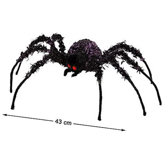 En Gigantisk Hårig Spindel med röda ögon och långa, svarta ben, med en pil som visar en bredd på 43 cm.