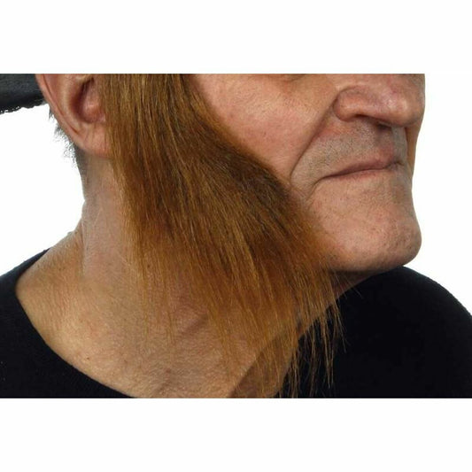 En man i profil visar upp ett par långa, raka och bruna löspolisonger, perfekta för en guldgrävare- eller cowboy-look.