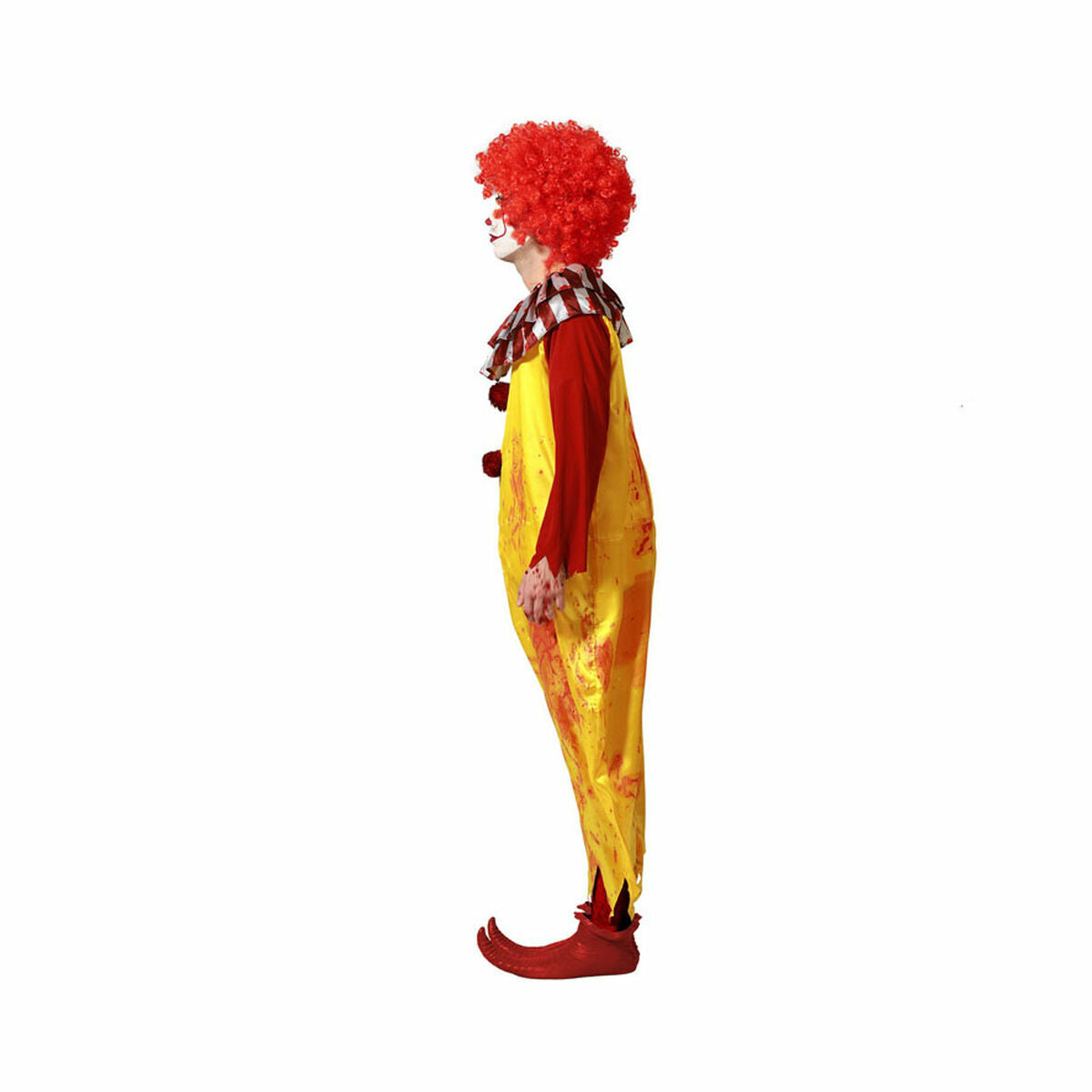En person står i profil och bär den blodstänkta, gula och röda clowndräkten.