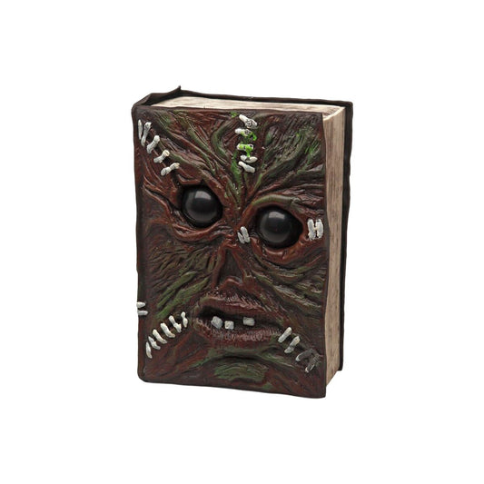 En läskig halloweendekoration i form av en bok med ett monsteransikte med hopsydda detaljer.