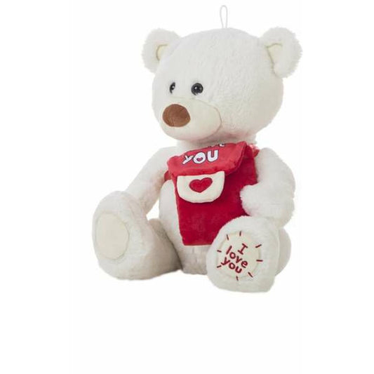 En sittande vit mjukisbjörn som håller i en röd axelremsväska med ett hjärta och har texten I love you broderat på ena fotsulan.